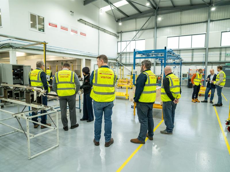 Visitors touring the Preformed Windings manufacturing facility