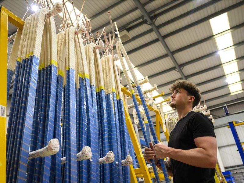 Insulated high-voltage coils on the curing racks at Preformed Windings